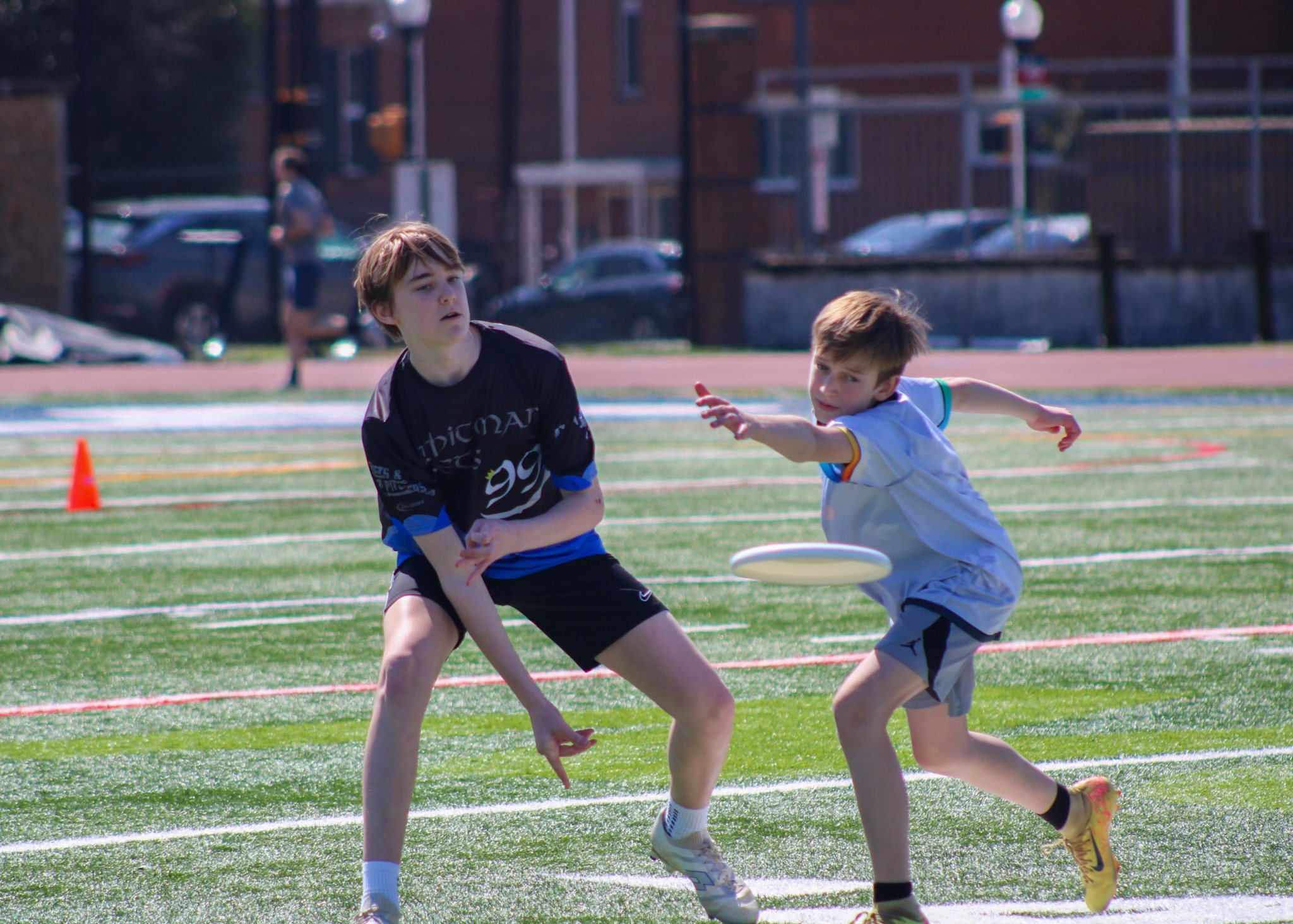 A Whitman Poets player releases a backhand past the mark