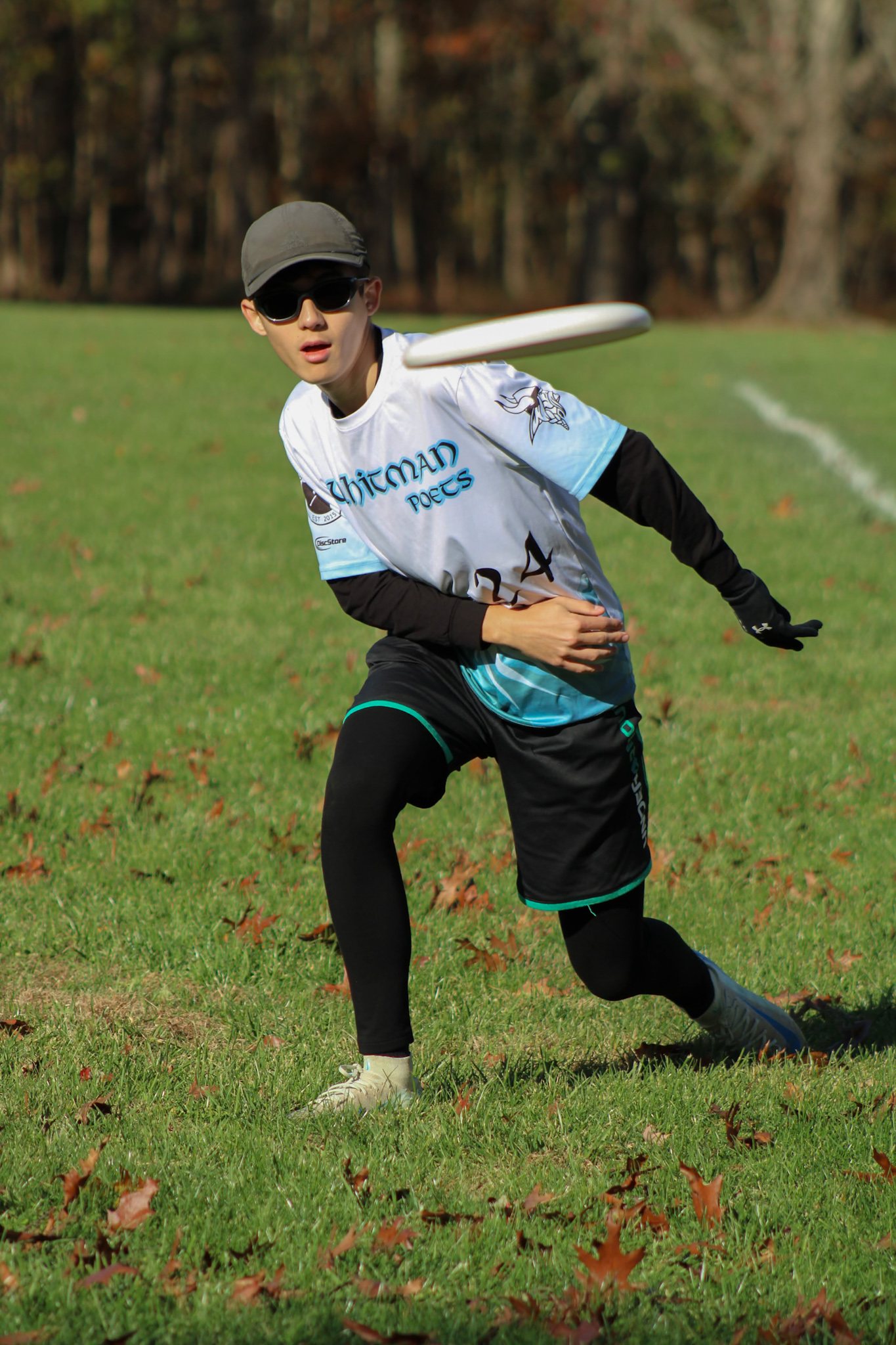 A Whitman Poets player releasing a throw